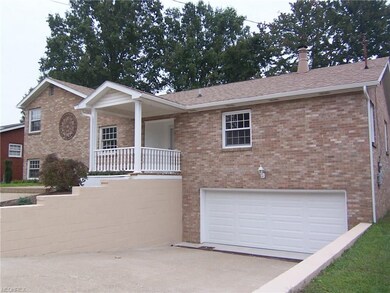 The garage can accommodate two cars and the drivew