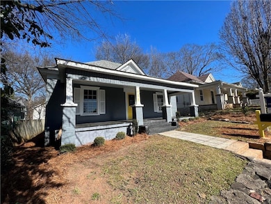 Bungalow-style home featuring fence and covered porch