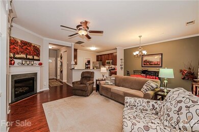Living room opens to kitchen