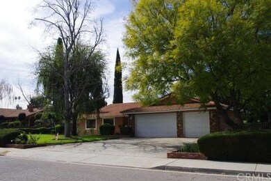 WIDE DRIVEWAY TO THREE CAR GARAGE