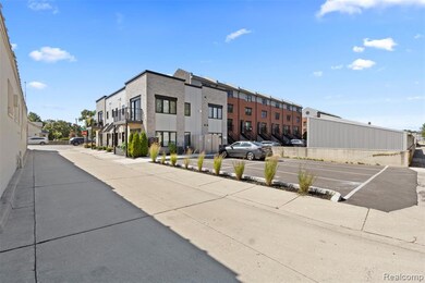 View of concrete road featuring sidewalks
