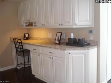 Custom built desk/multi task area off kitchen & family room.