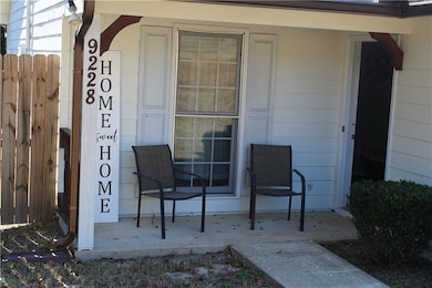 View of exterior entry featuring a porch