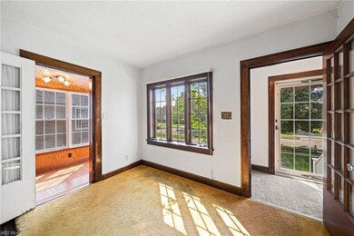 Carpeted empty room featuring a wealth of natural 