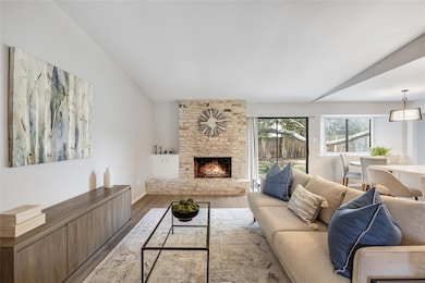 Living room featuring wood finished floors, a fir