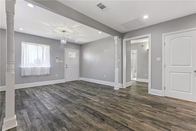 Columns separate the living and dining room, With