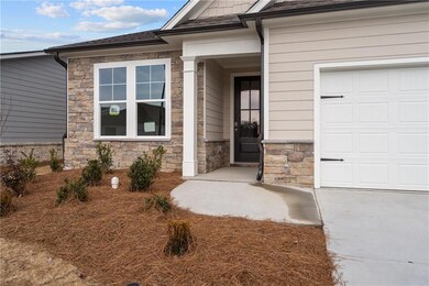 View of exterior entry featuring a garage