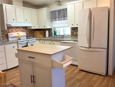Open Kitchen, White appliances/ Granite Counters