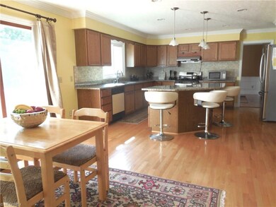 Large kitchen with granite counters, hardwood floo