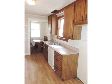 Kitchen. The galley style kitchen has updated cabinetry  and flooring