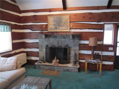 Stone Fireplace in the Great room with hemlock woo