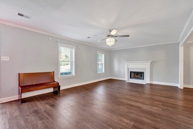 Unfurnished living room with dark hardwood / wood-