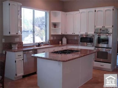 open kitchen with granite countertops and stainles