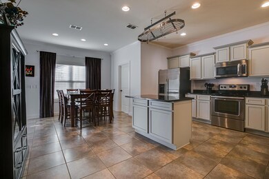 Granite and stainless steel appliances in the kitchen!
