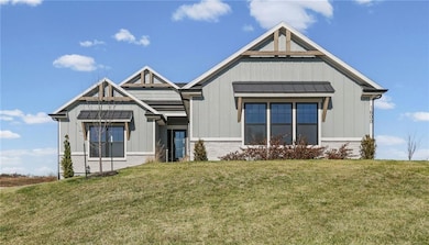 Modern inspired farmhouse featuring board and batten siding, a front lawn, a standing seam roof, and a metal roof