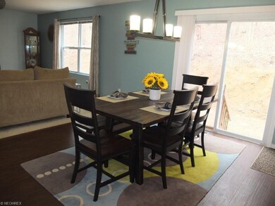 Dining room with slider to backyard is open to the