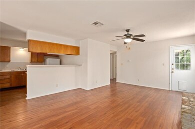 Unfurnished living room featuring wood finished f