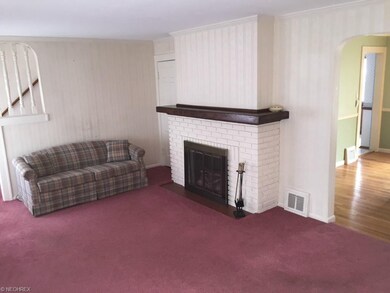 There is a small half bath to the left of the fire