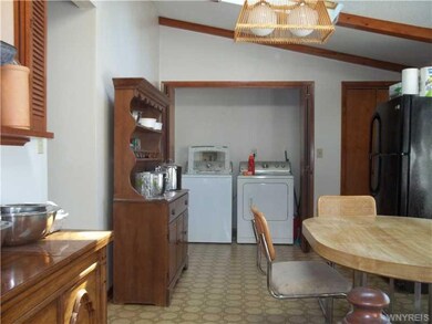 Breakfast Room. This room connects with kitchen and the 4 season room and has the laundry and a large pantry to the right.