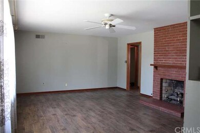 Living room with double-sided fireplace into famil