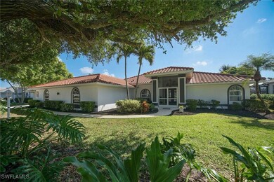 Mediterranean / Spanish house with a front lawn, a