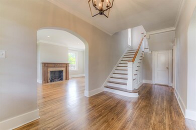How impressive is the grand foyer as you enter the house! Look at the sparkling refinished hardwood floors and designer colors!