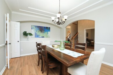A sophisticated gathering space for breaking bread, the dining room is embraced by arched walls and crowned by graceful tray ceilings.