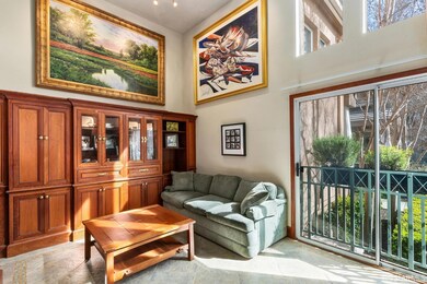 The living room boasts super high ceilings, and go
