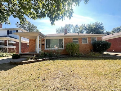 Ranch-style house featuring a front lawn, a chimney, and brick siding