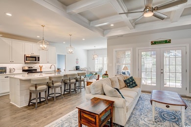Living room with coffered ceiling, beamed ceiling,