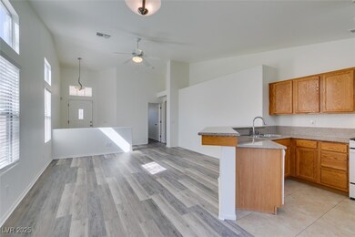 Kitchen featuring visible vents, open floor plan,