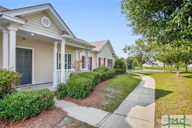 Lush landscaping welcomes you to the front porch.