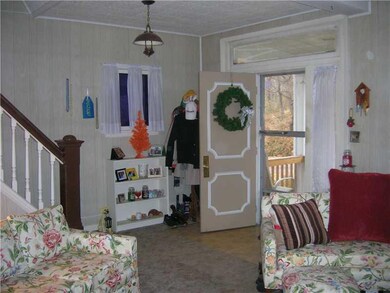 Living Room. View of the front entry from the dini