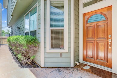 The entryway includes a gated side entrance for ad