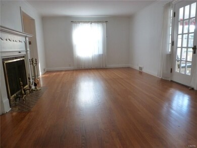Living room with wood burning fireplace