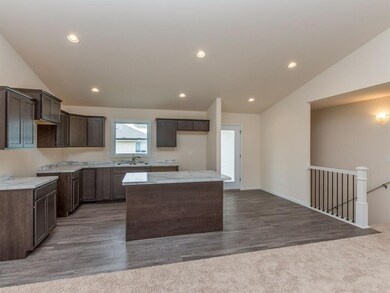 Kitchen w/island style Breakfast Bar.