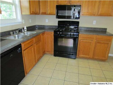 KITCHEN HAS GAS RANGE, DISHWASHER AND BUILT-IN MIC