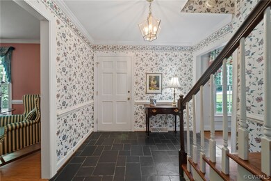 The Welcoming Foyer features Tile Flooring, Crown