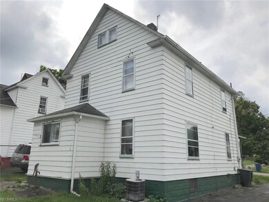 View looking northwest showing the rear of the hou