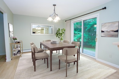 Kitchen opens to dining room and views to deck and yard