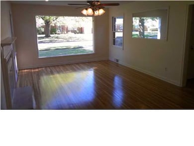 Living room with huge picture bedroom.