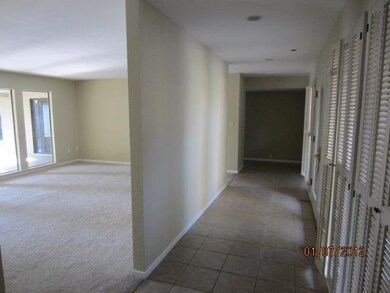 Tile entry with views to formal living room