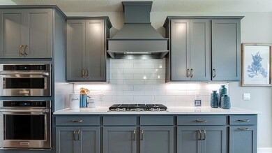 Stunning kitchen finishes.  Actual home will have white cabinets.