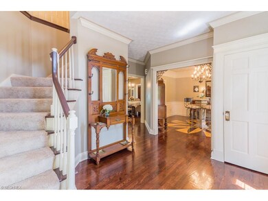 Gracious Foyer with Hardwood Floors opens to the F