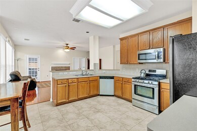 This large kitchen flows seamlessly into the breakfast area as well as family room.