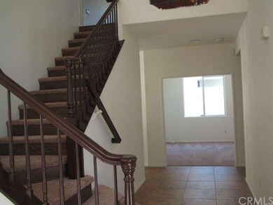 stairs, hallway and downstairs bedroom view