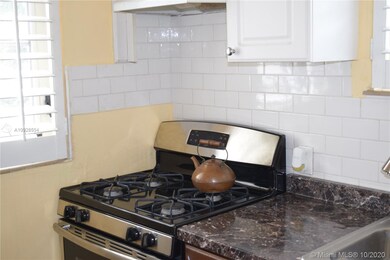 Updated kitchen with granite counter tops.