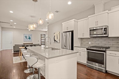 Kitchen featuring appliances with stainless steel