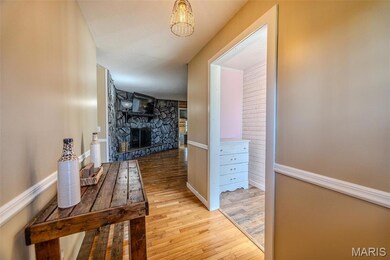 Corridor with light wood-type flooring