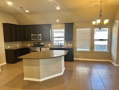 SPACIOUS KITCHEN WITH ISLAND AND GAS STOVE